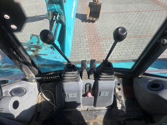 Koparko ładowarka Komatsu 95 - 15