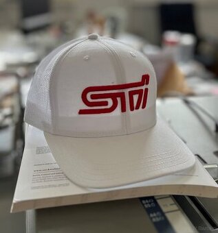 I am selling a white Subaru STi cap with 3D logo