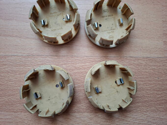 NISSAN 4 oryginalne dekieleki do felg 54mm - 2