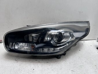 Reflektor lewy KIA Carens 92101AA - 2